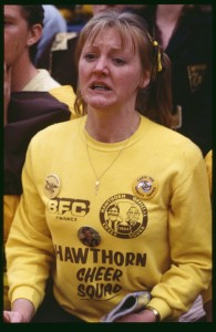 A member of the official Hawthorn cheer squad watches the game.