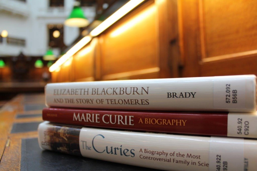 Images of three books sitting on a desk in the La Trobe Reading Room