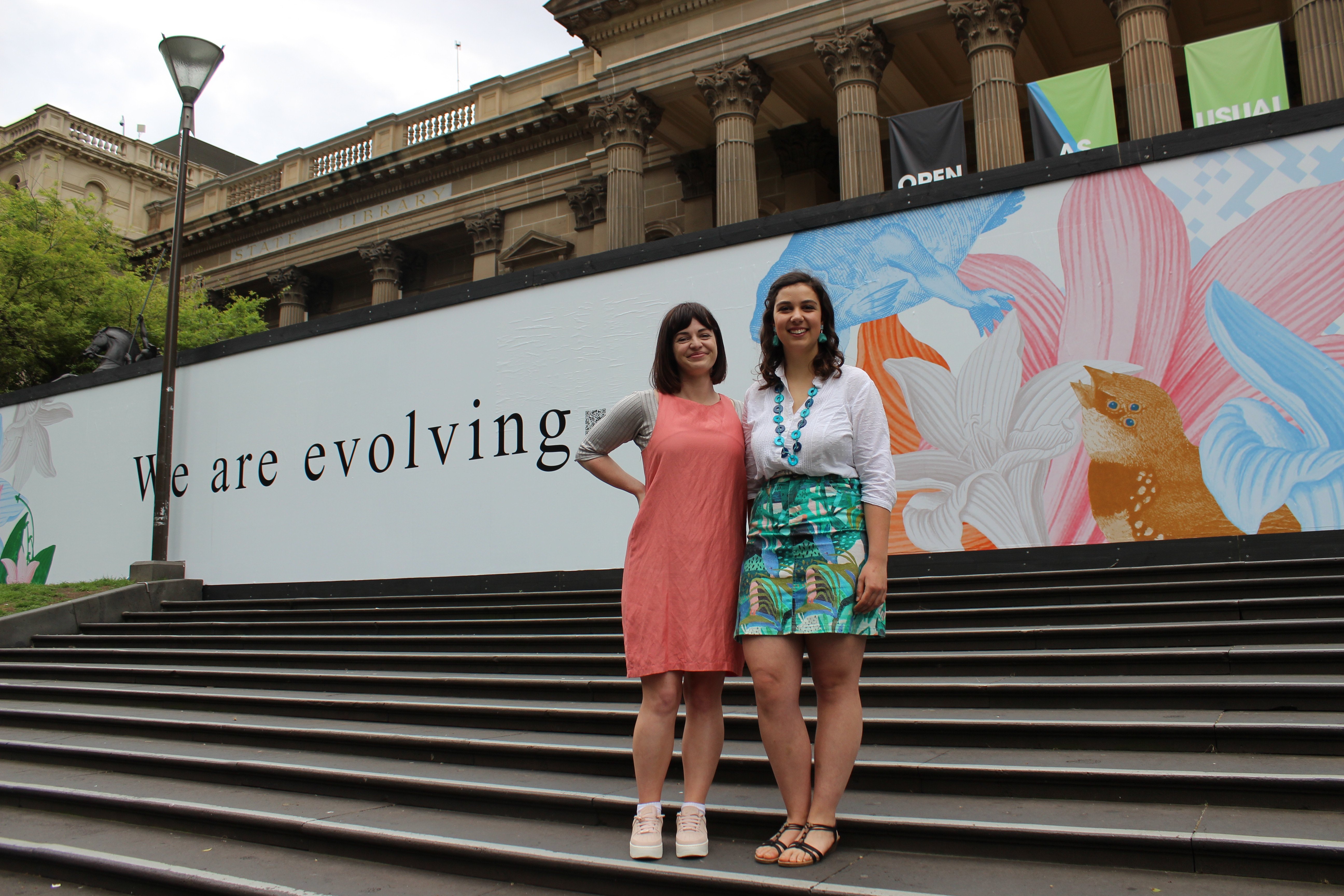 RMIT students in front of artwork