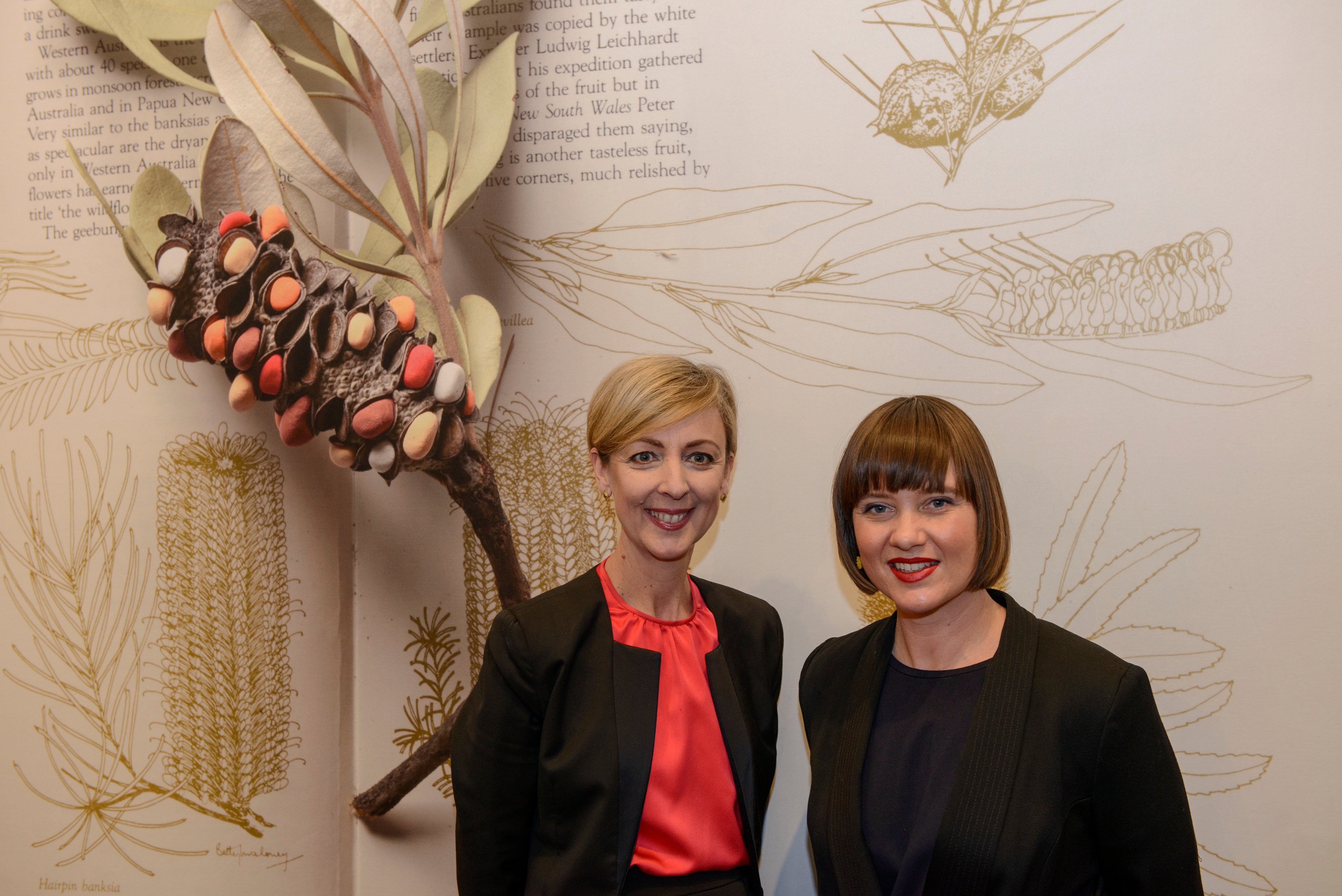 State Library Victoria CEO, Kate Torney and artist Tai Snaith in front of a large book