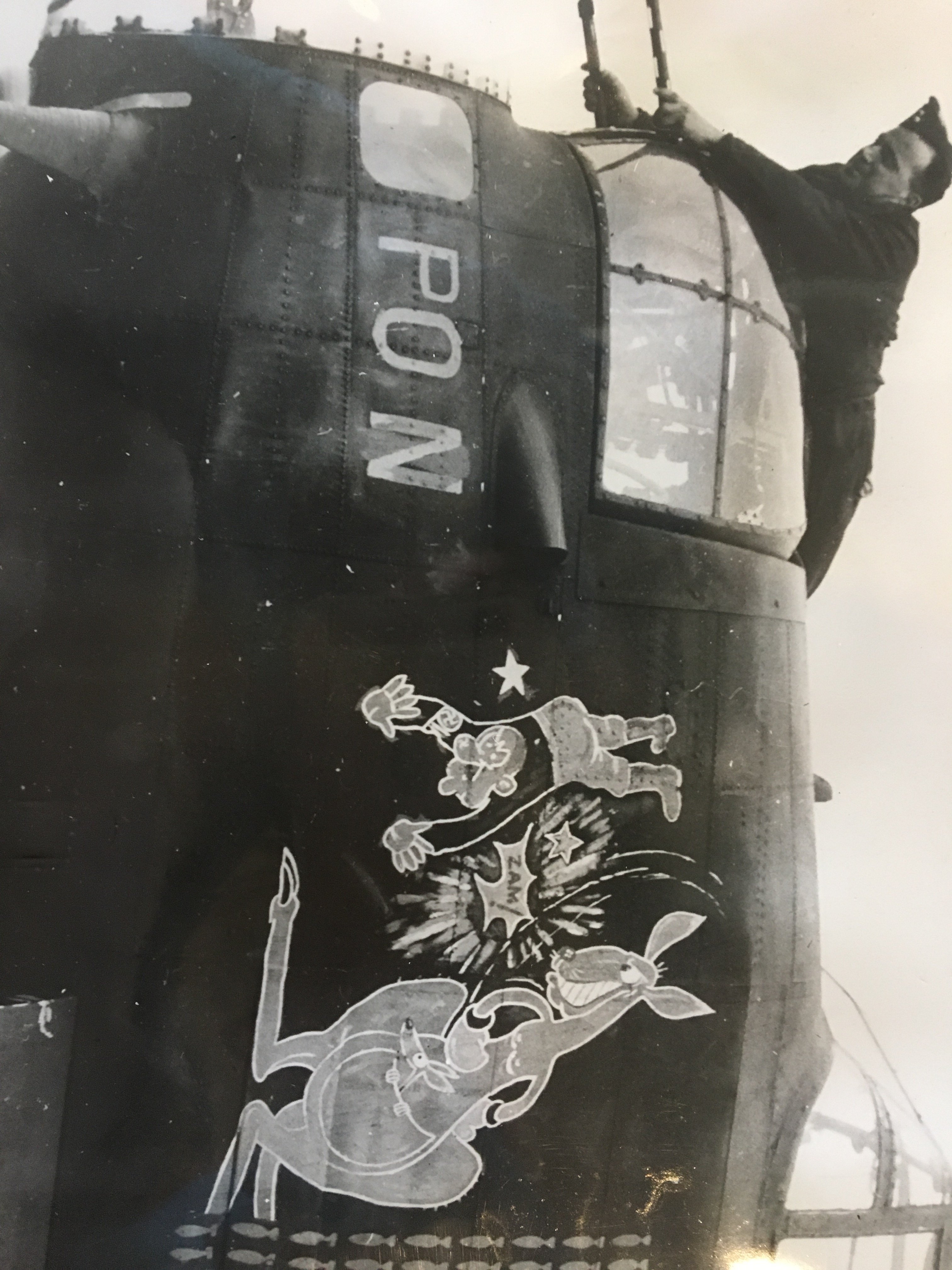 N-Nuts: Boxing kangaroo with joey punching Hitler, row of bombs alongside, letters PON painted on nose of plane [Emblems on R.A.A.F. Squadron aircraft in the R.A.F. during World War II ca. 1943-45]; H2000.200/1809-1827