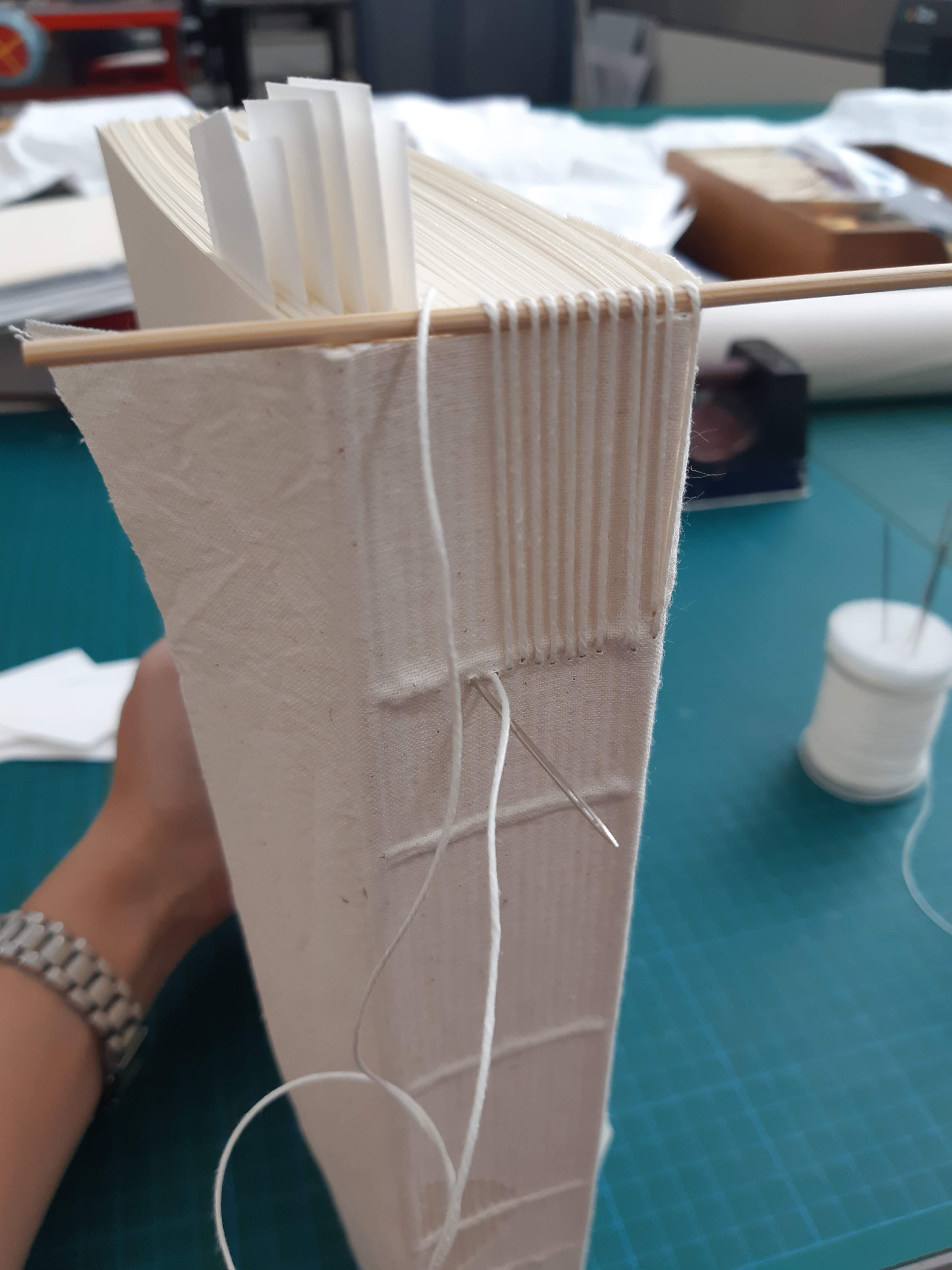 Spine of book model displaying sewing