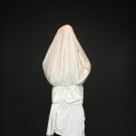 Sculpture covered with white sheet