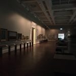 Empty gallery with dim lighting