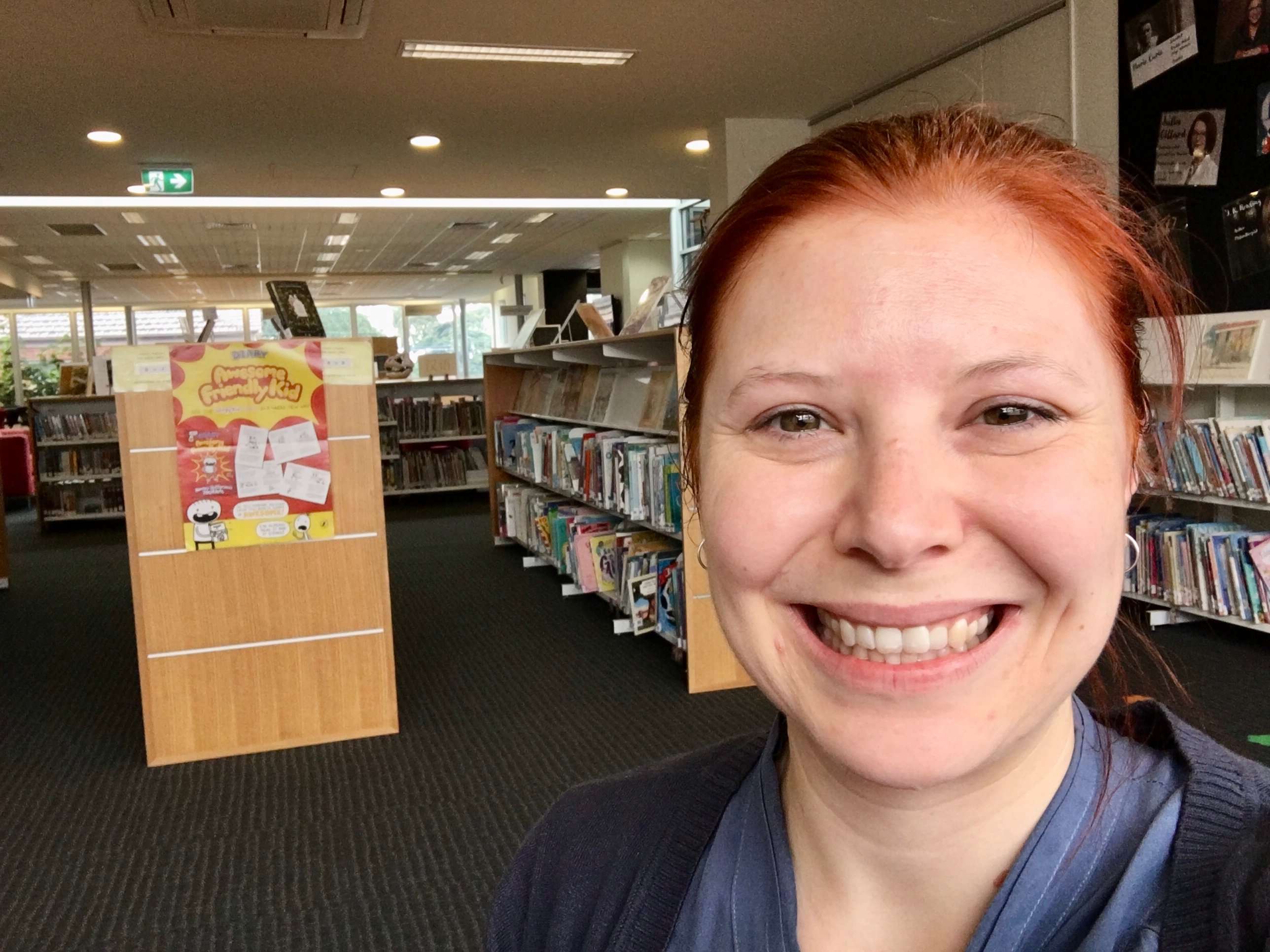 Portrait of woman in front of Library shelf