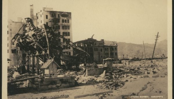 A sepia photograph showing ruined buildings in Hiroshima after the nuclear bomb was dropped in 1945.