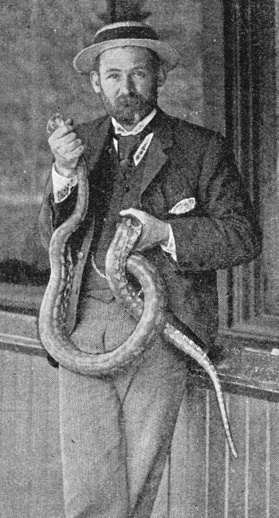 Mr. Dudley Le Souef holding snake
