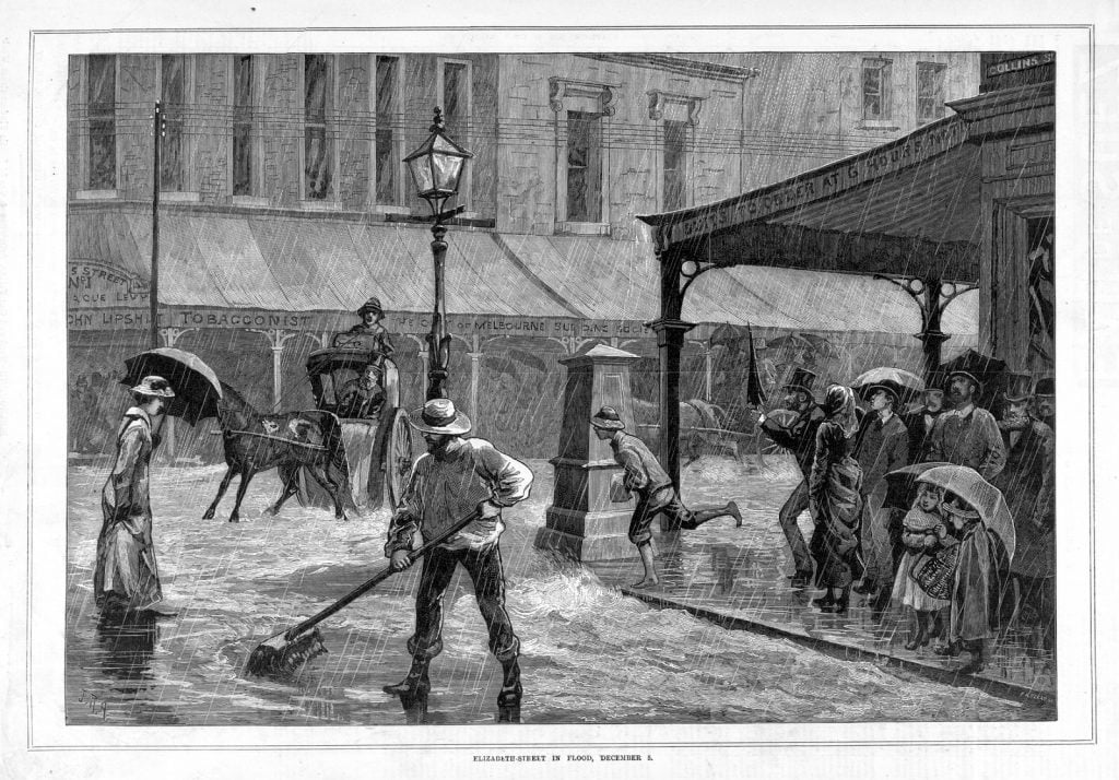 Black and white illustration depicts street scene, heavy rain, people ankle deep in water, man sweeping road with large broom.
