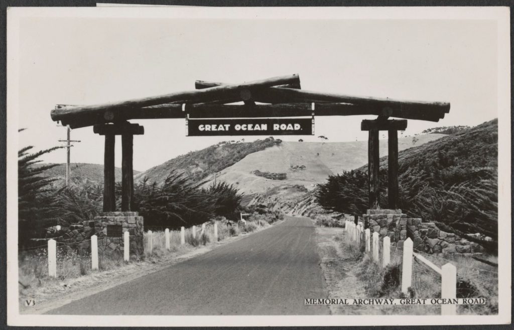 photograph of memorial archway at the entrance to the Great Ocean Road, constructed from logs on stonework pilllars