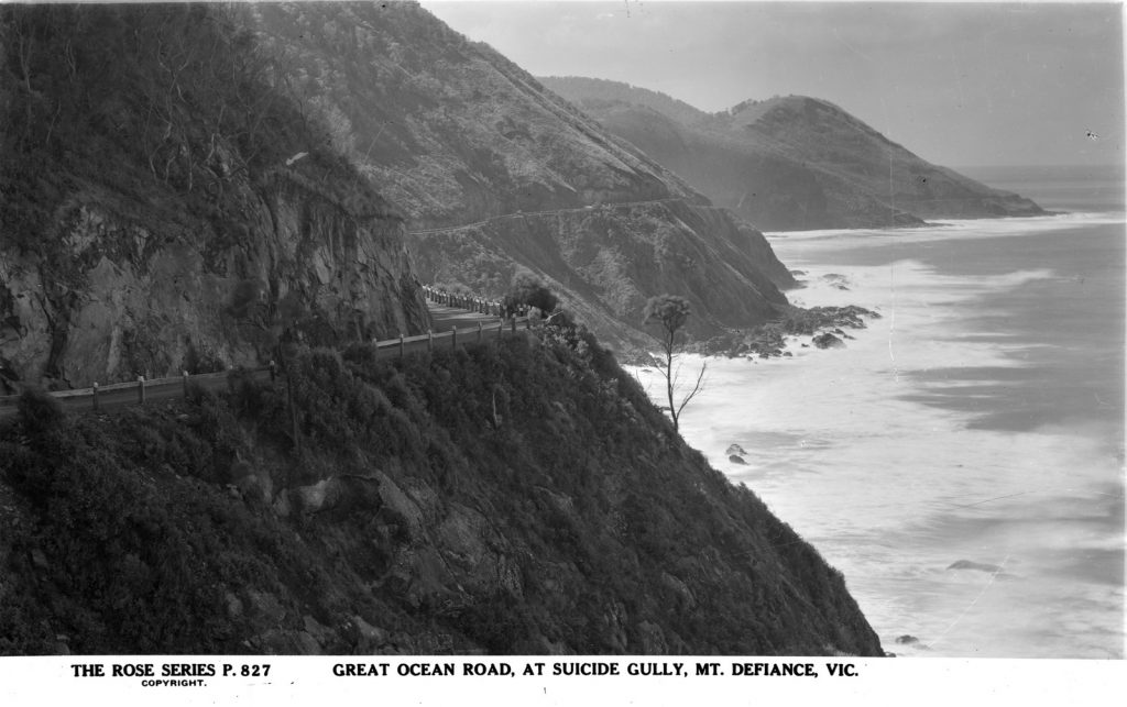 photograph of the road along the hillsides on the left, the sea on the right.