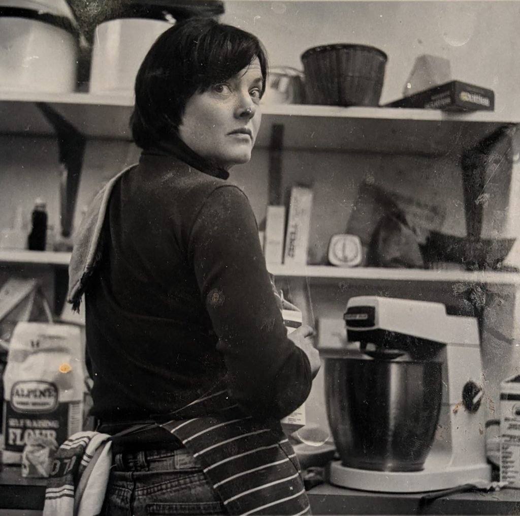 Black and white photo of Stephanie Alexander in the kitchen