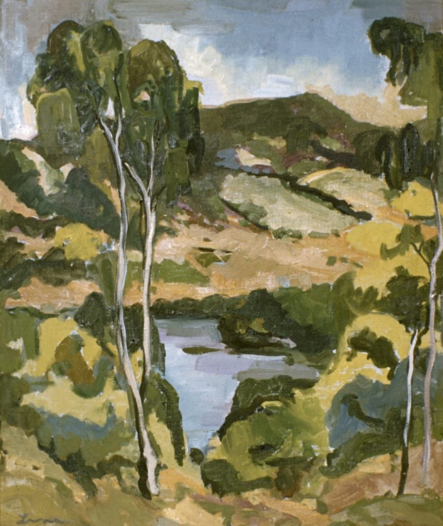 photograph of oil painting, view across wooded hills with a waterway below, patchy clouds in a blue and grey sky.