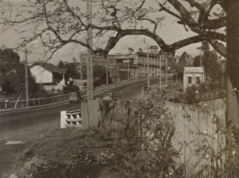 Black and white photo of view of suburban street