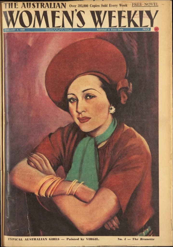 Woman wearing a red hat and top with a turquoise scarf