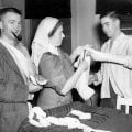 Nurse attending two wounded soldiers.