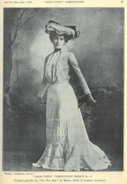 Woman wearing white designer gown and matching hat with lace detail