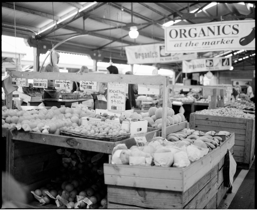 Photograph of organic vegetable and fruit stall at the Victoria Market, Melbourne