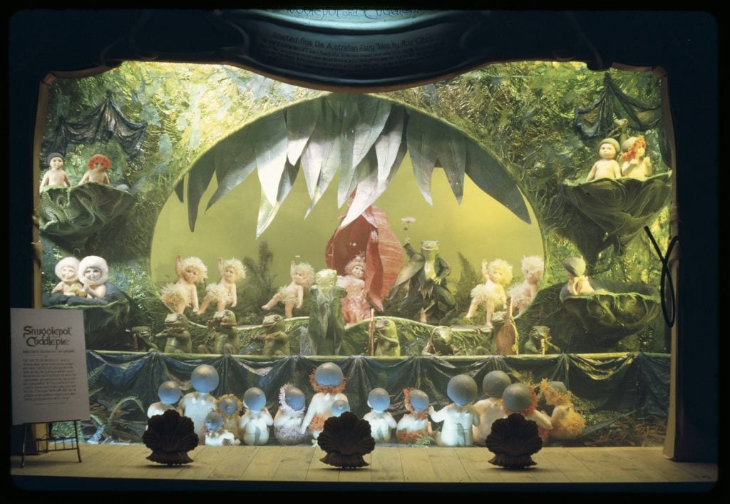 Colour image of Snugglepot and Cuddlepie scene from a Myer Christmas window, showing various 'gumnut babies' 