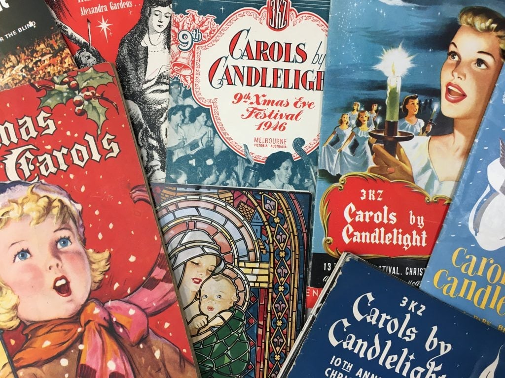 Selection of various front covers of Carols by Candlelight programs 