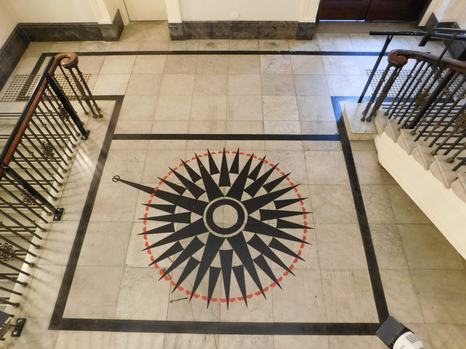 Bottom of the staircase with a view of the compass diagram