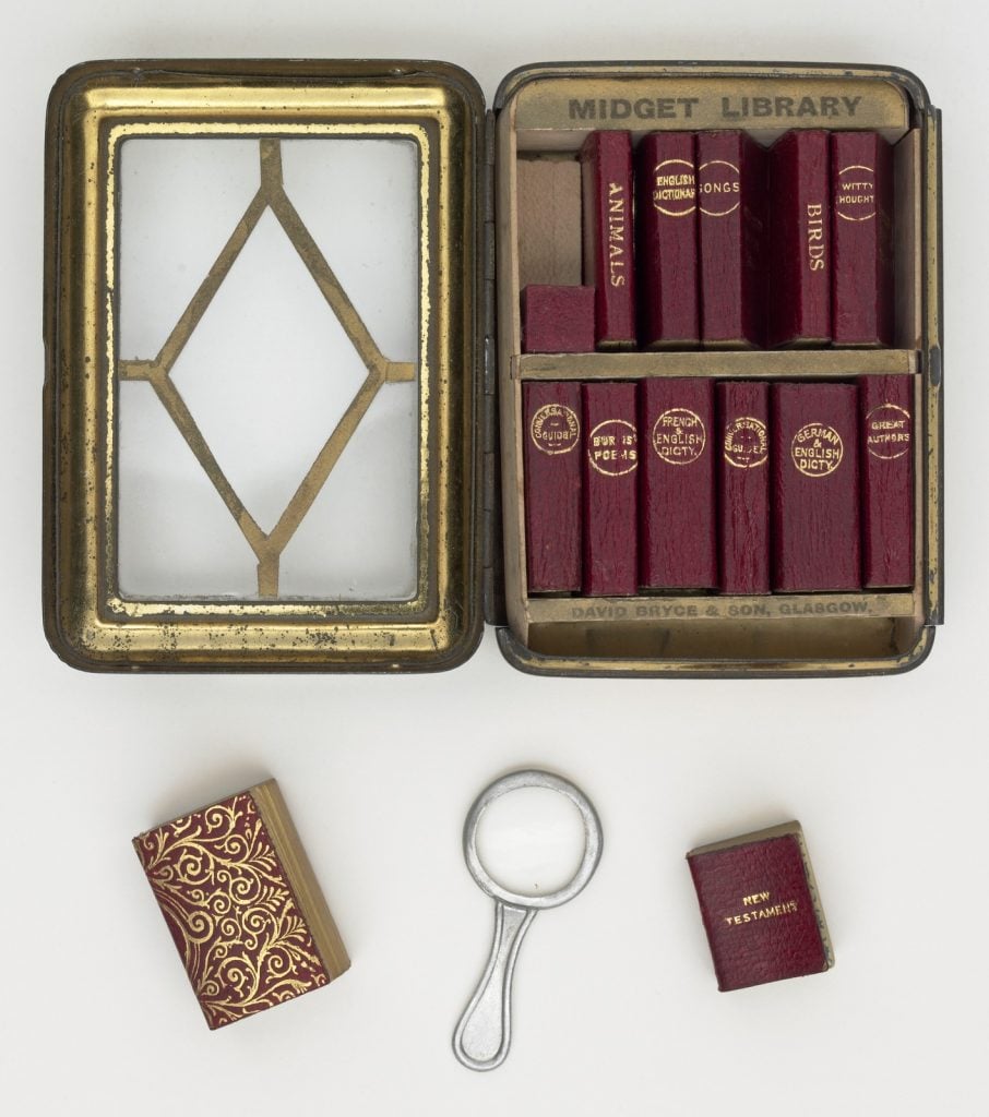 Midget Library - its miniature case, books and magnifying glass