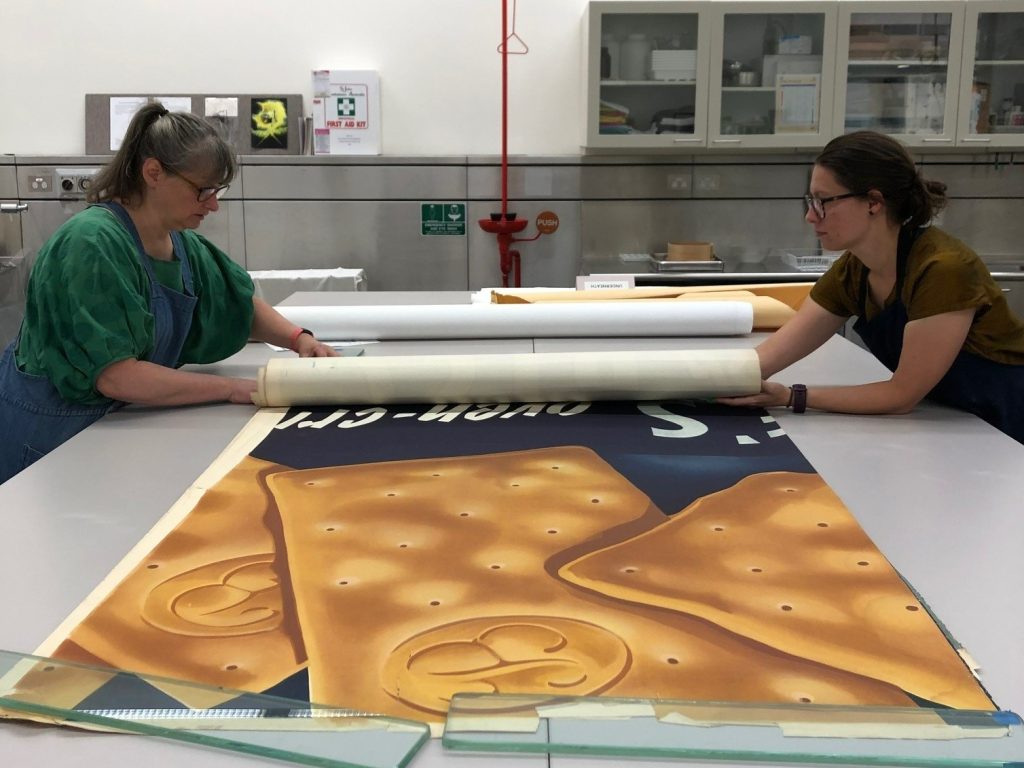 Carefully separating the rolled sheets; H97.146/4. Image credit: Albertine Hamilton