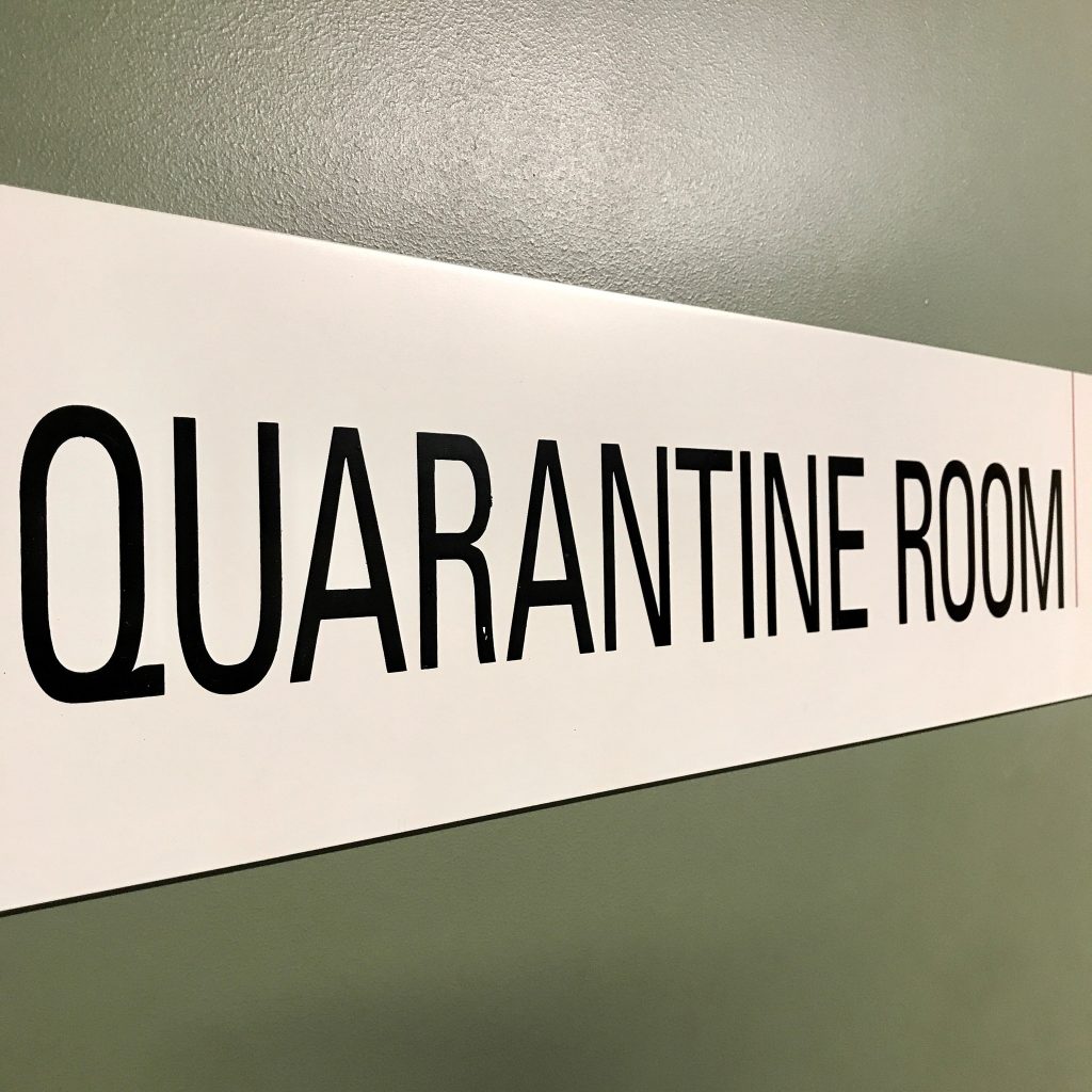 Signage and shelving in the Library’s Quarantine Room