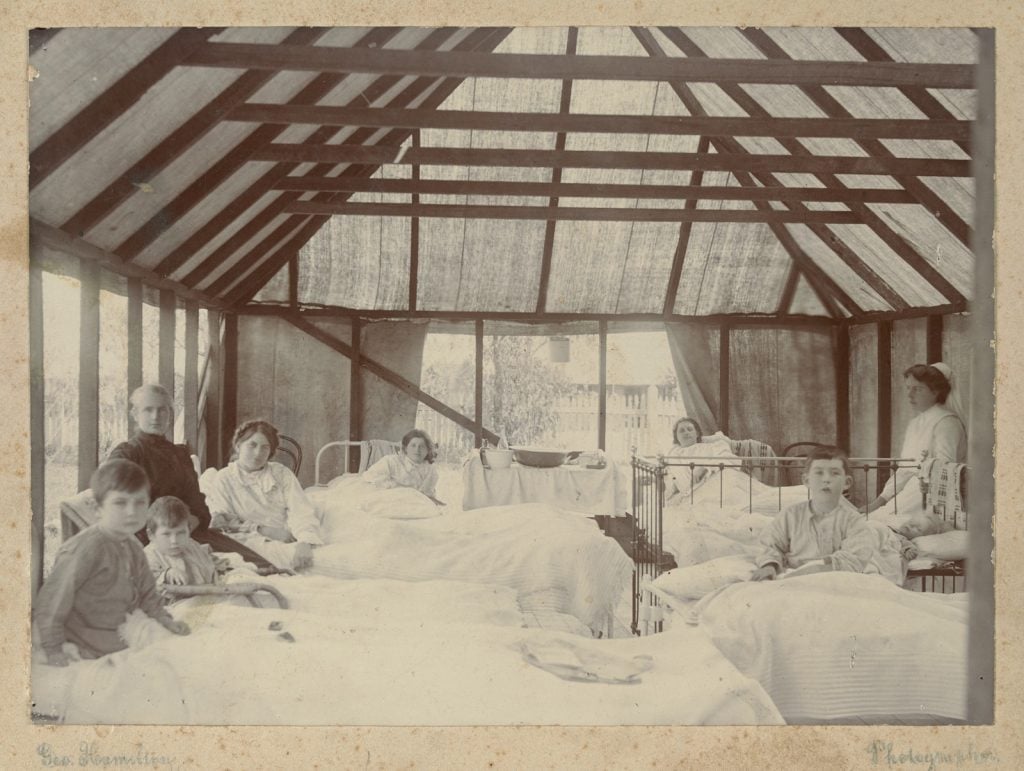 photograph of youn diptheria patients in a tented ward.