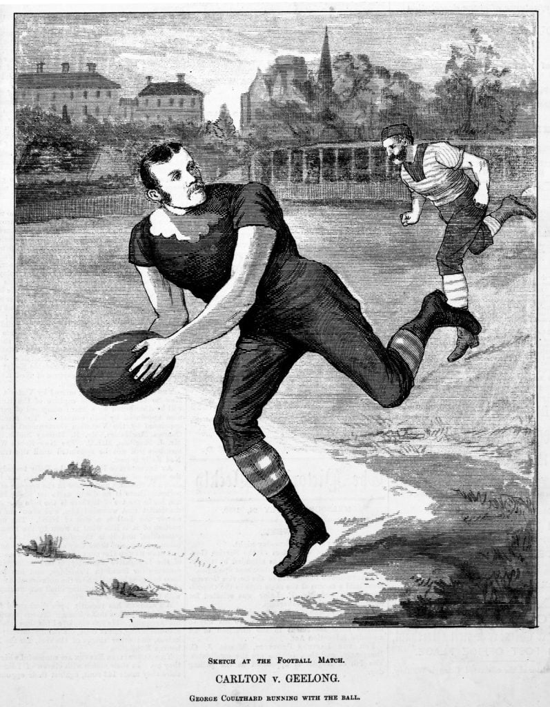 Carlton footballer George Coulthard, ball in hand, running away from Geelong opponent