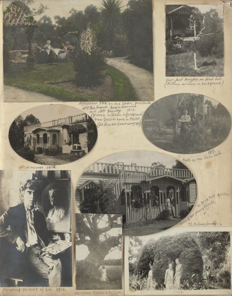 Page from a scrapbook with 8 pictures: 
coloured view of a garden, with 3 women sitting around a table having afternoon tea; magpie standing on a frame above a birdbath; 2 views of front of the house Winscombe, with ornate timber fretwork, painted a light colour; a couple standing in the garden; photograph of a man smoking a pipe, holding a palette with paint, a portrait on an easel behind; photo of a woman standing beside a huge river red gum, phot of 5 people around a hedge arch., 