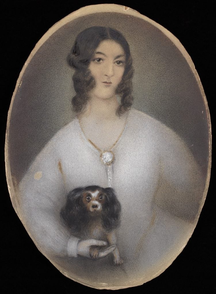 Portrait of Mrs. Caroline Liardet, holding a small black and white dog on her lap.