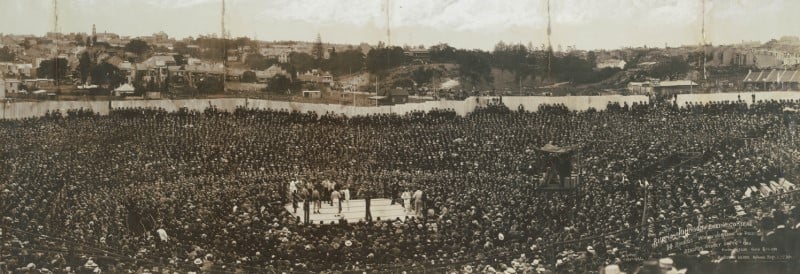 Image of vast crowd at open air boxing event. 