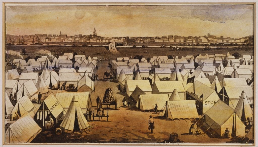 Print shows the Lennox Bridge (now location of Princes Bridge) over the River Yarra, and its graded approach from the south side, with the city of Melbourne beyond. Tent city known as Canvas town is pictured, with white pitched tents and some makeshift buildings clustered, and a butcher and stores tent visible.