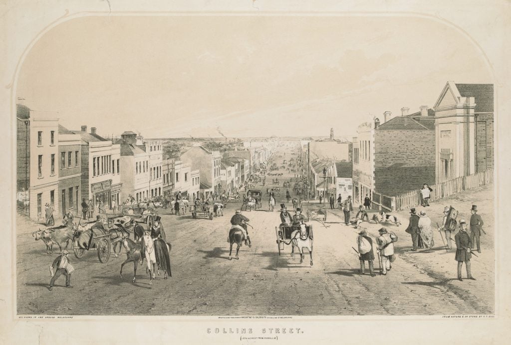 Shows the city of Melbourne from Eastern Hill, including Mount Macedon in the distance. A number of small cottages can be seen on what is now the land between Albert Street and Victoria Parade. A small stone building with gothic windows, in the course of construction, is the Baptist Chapel designed by John Gill in 1853. This building was incorporated into the Baptist Church erected on the site in Albert Street in 1858/9 by Thomas Watts.