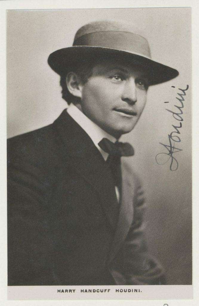 Harry Houdini in hat with signature