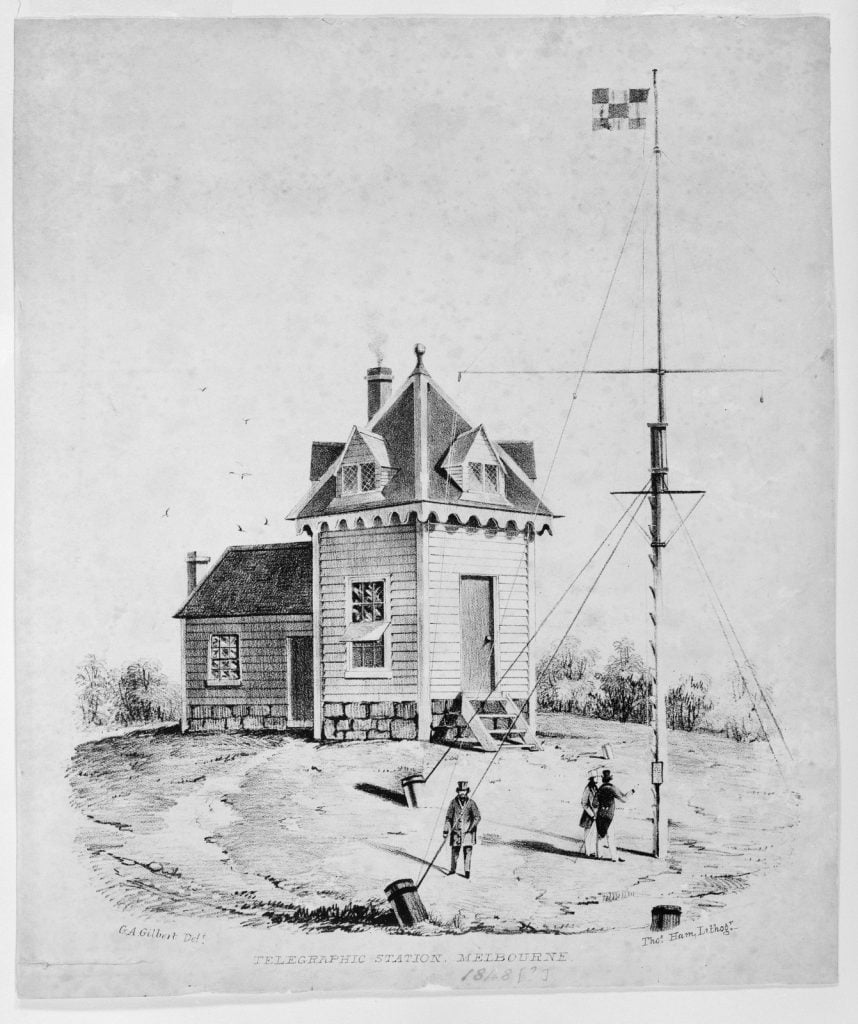 Timber and stone building (originally the signaller's store and dwelling, with pitched roof (the telegraphic station), and beside it the flag staff, with some figures standing at its base.