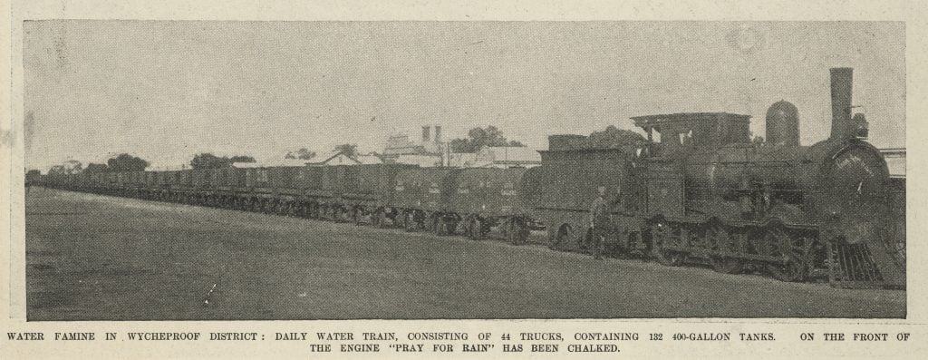 Long steam train carrying 44 trucks of water during drought in Wycheproof area, 1901. Message written in chalk on front of engine: "Pray for rain." From The Australasian, 1 June 1901, page 1214.  