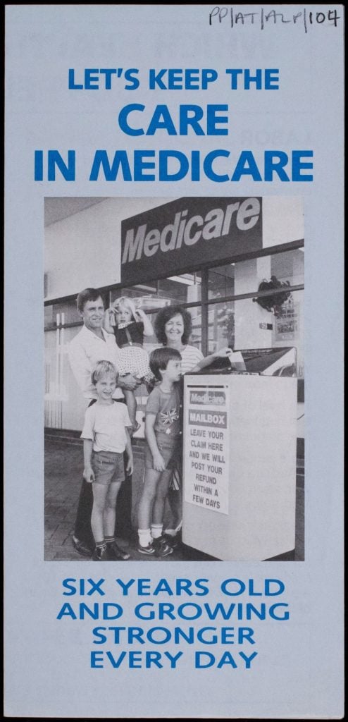 Front cover of Labor Party pamphlet. Blue text and background. Black and white photograph of a family of five standing outside a Medicare office in the centre. Young boy putting a Medicare claim in a 'Medicare Mailbox'.