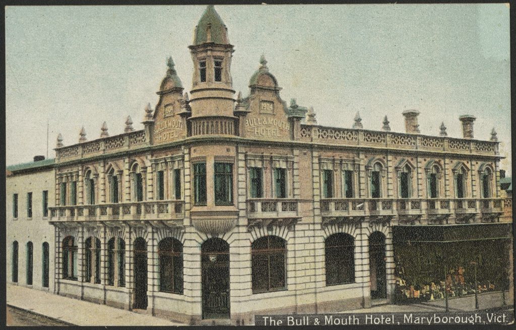 Corner view of the exterior Bull and Mouth Hotel. signage on the front of the building is evident.