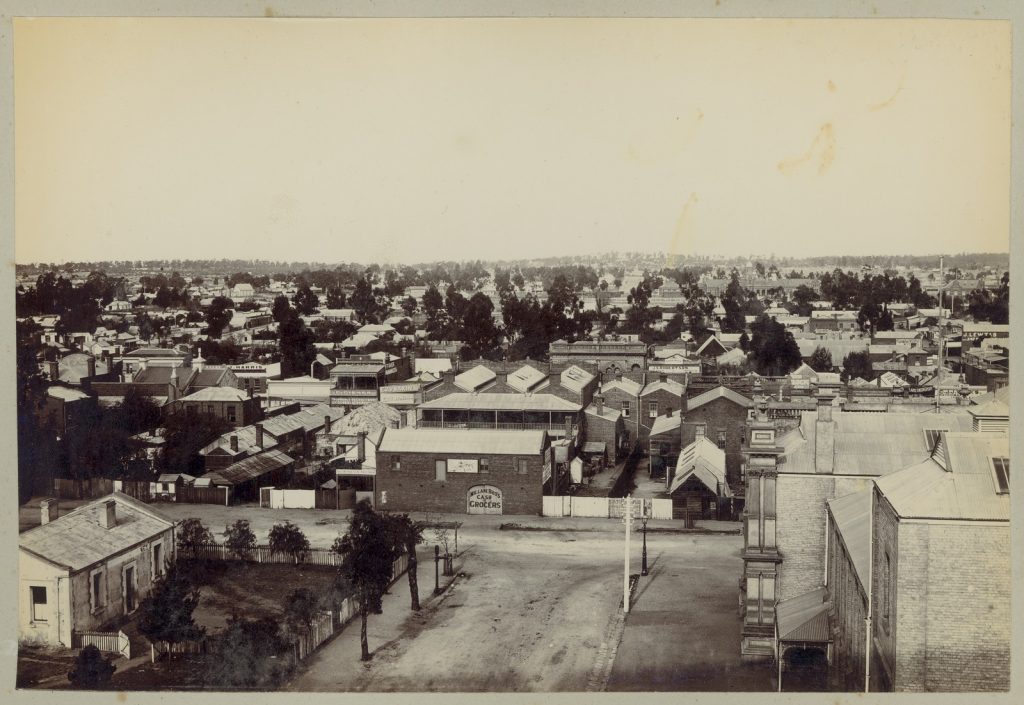 Black and white photo shows elevated view over the rooftops of Maryborough