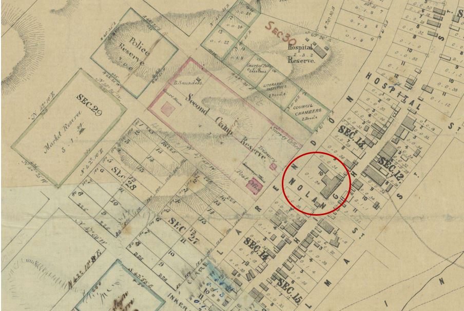Historical plan shows allotments in central Maryborough and outlines of buildings. The Market Reserve, Police reserve, Second Camp Reserve and Hospital Reserve are all labelled. The location of Bull and Mouth Hotel is circled on the map.