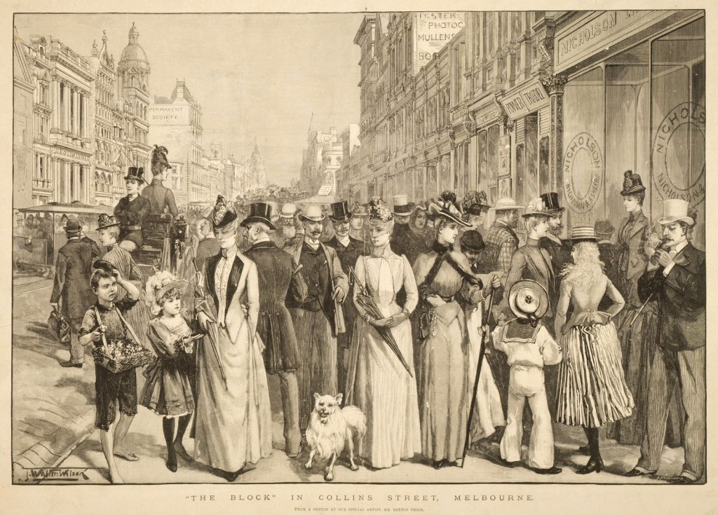 Depicts a group of fashionably-dressed men, women and children, many wearing hats. Small dog in foreground. Group is standing on Collins Street with prominent buildings visible on both sides of the street.