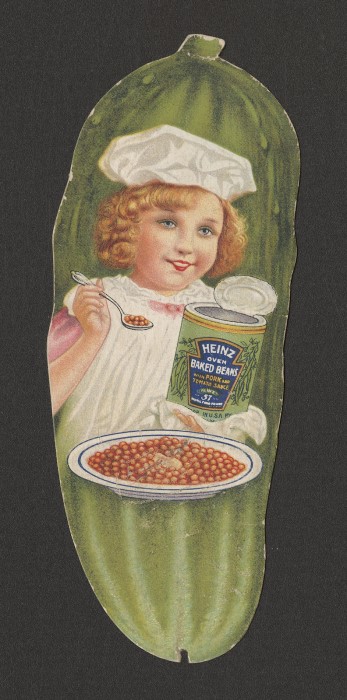 Girl in pickle shaped picture eating baked beans