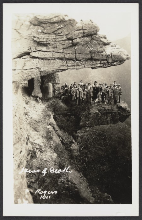 Group of tourists on rock