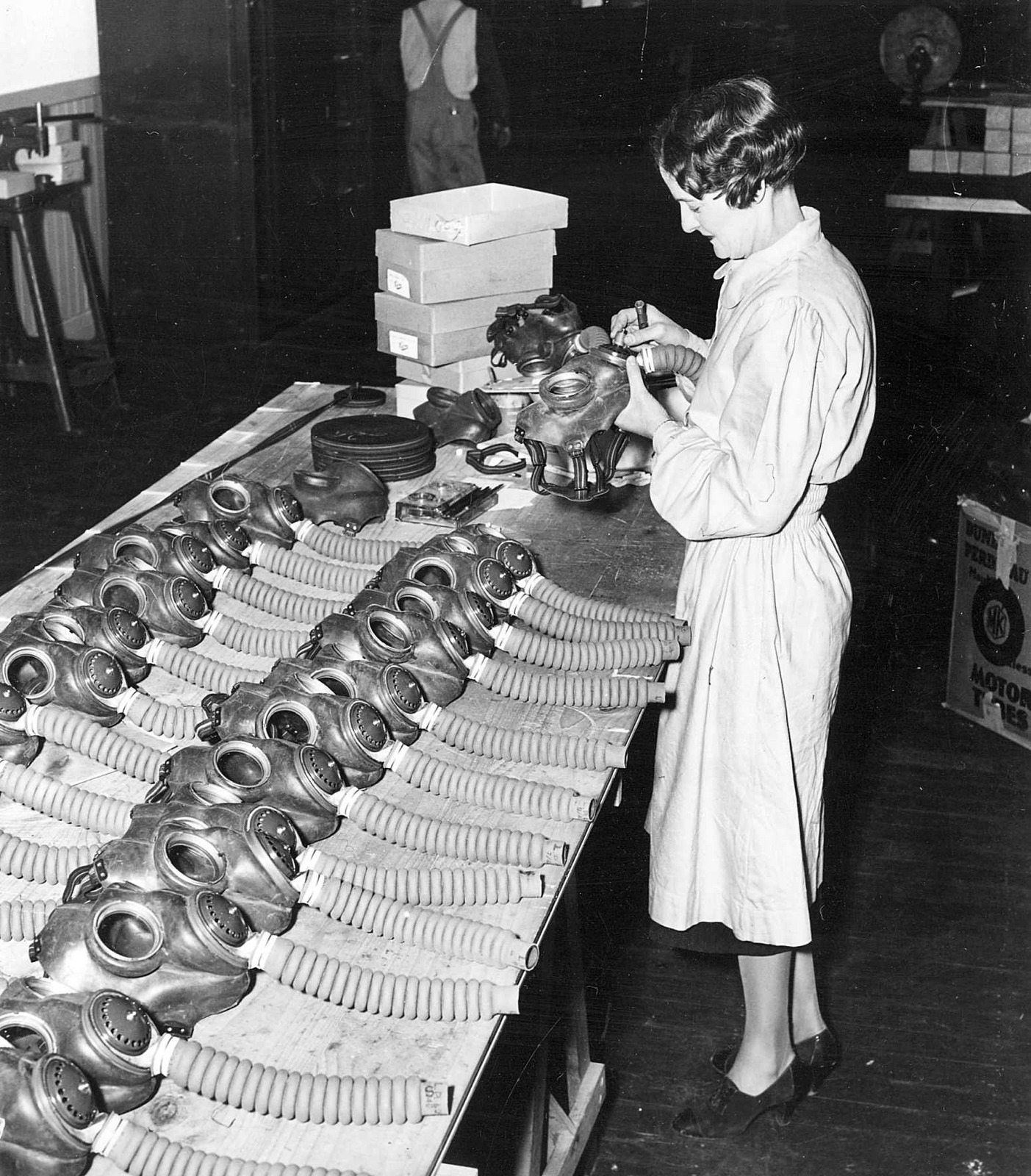 Woman inspecting gas masks