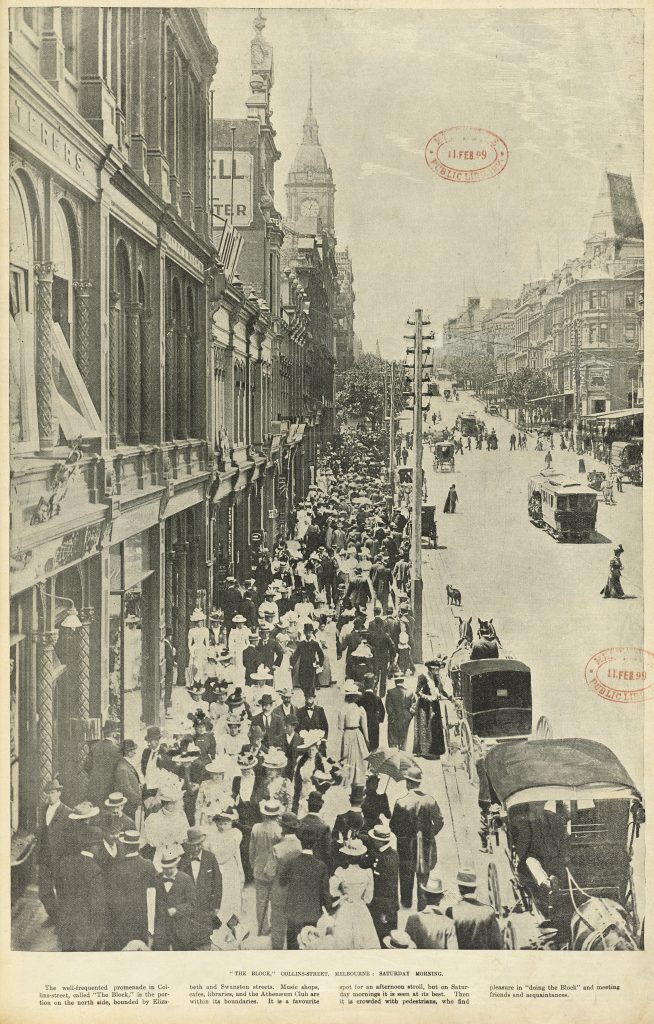 Photo from a newspaper depicting Collins Street intersecting with Swantson Street. Melbourne Town Hall clock tower visible in the background. Throngs of pedestrians on Collins street, dressed in fashionable attire, many wearing hats, walking up and down past the shopfronts on Collins Street. Also visible on the road are horse drawn handsome cabs and a cable tram.