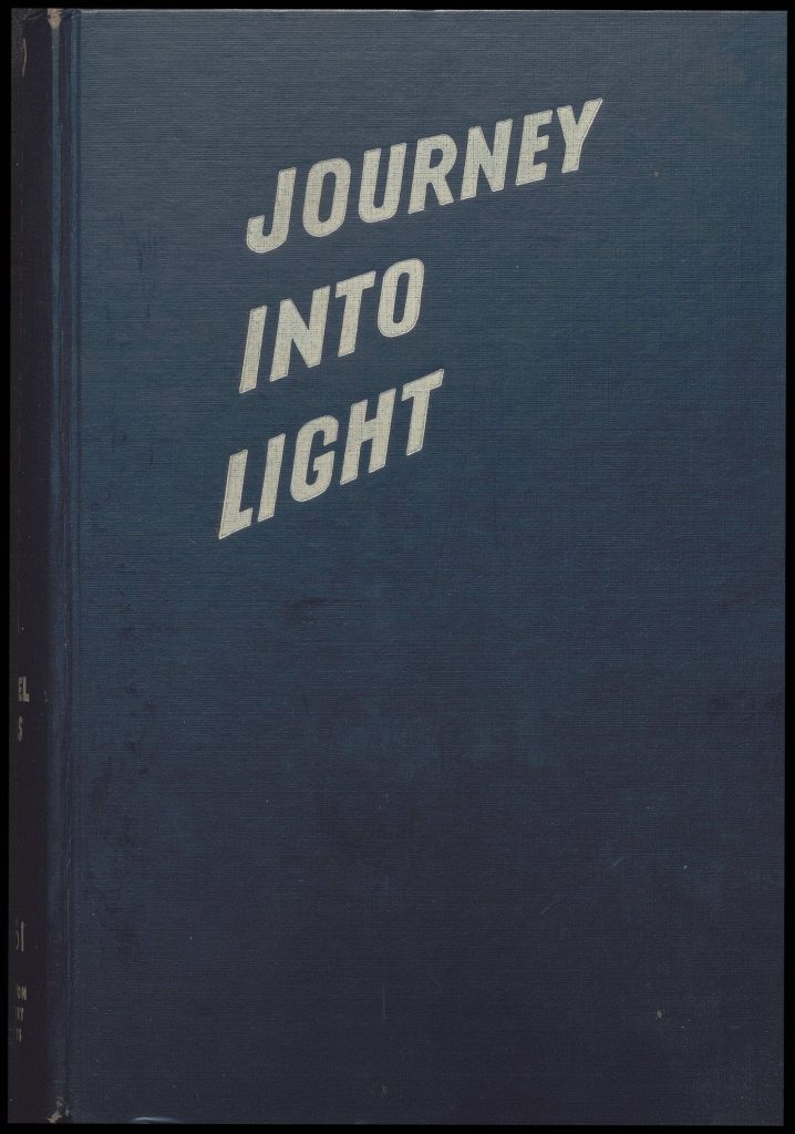 Navy blue book cover. Title reads: 'Journey into light.'