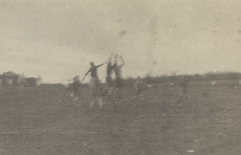 Men flying for football.