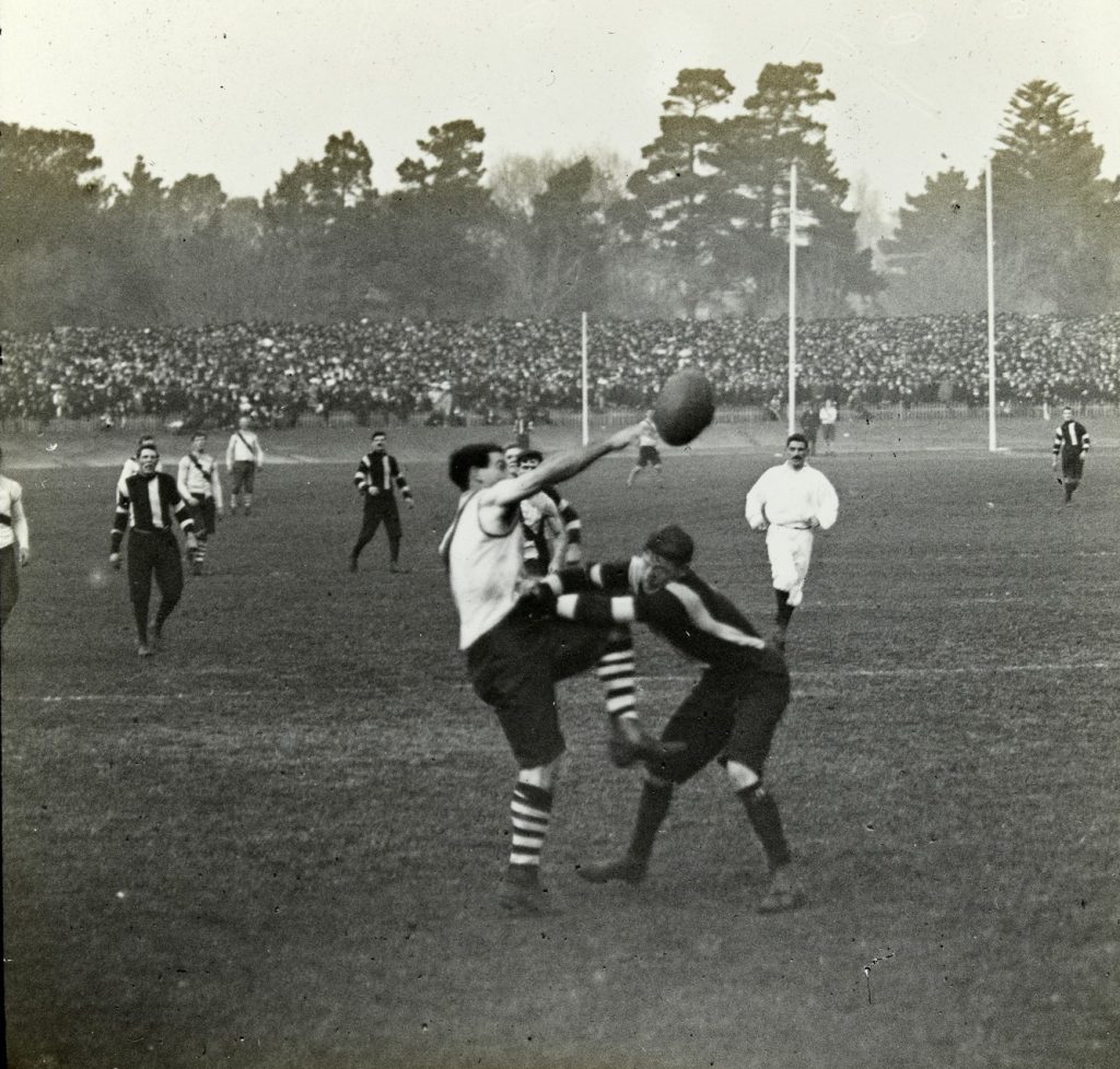 Footballers competing for the ball.