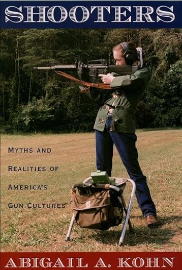 Cover image of Shooters showing a woman in a paddock with gun paraphernalia and firing a large gun.